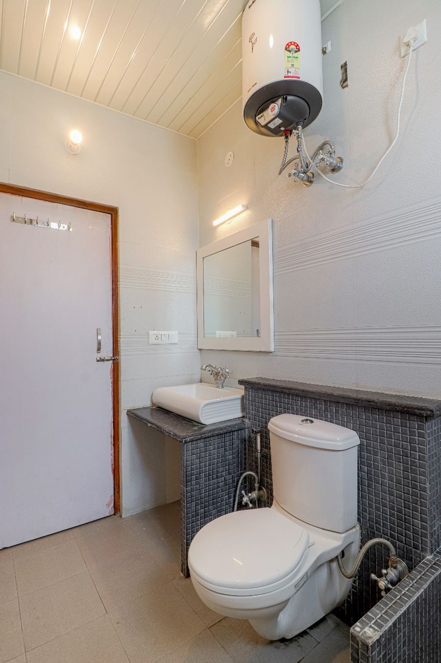 Modern washroom with sink counter hotel in dehradun