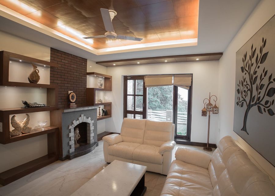 Living lounge with fireplace at ridgewood manor homestay