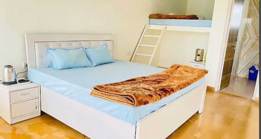 Double bed with bunk bed room royal stay farm house gurgaon