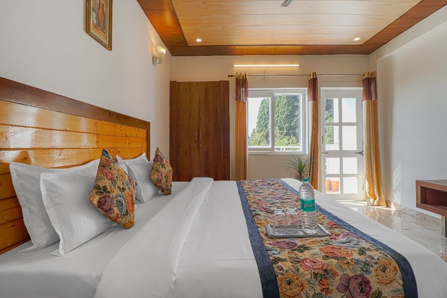 Bright master bedroom setup apartments in dehradun