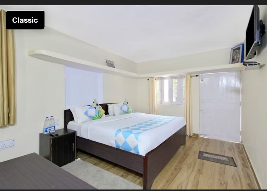 Cozy double bed setup with nightstands and clean white linens in Bhimtal