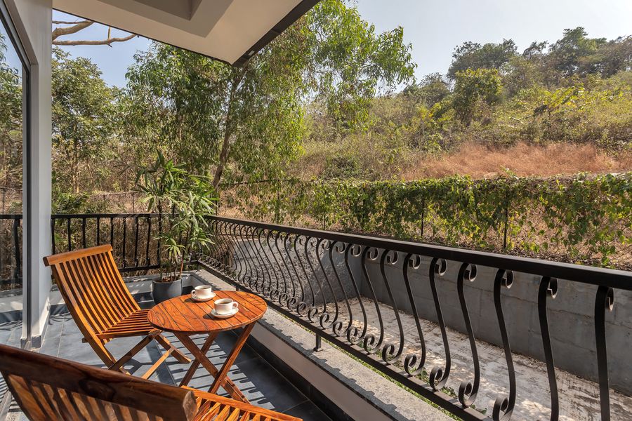 Private balconModern luxury villa exterior lawn at lavender villa in goa terrace with chairs at lavender villa goa
