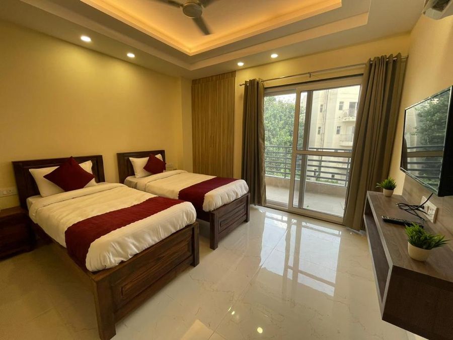 Twin beds bedroom with balcony at my stay service apartment