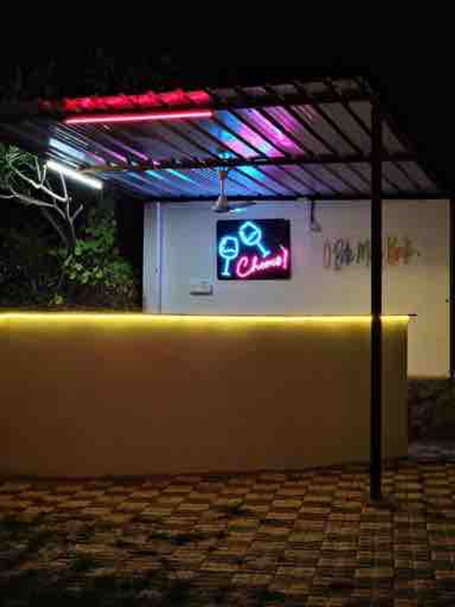 Illuminated bar counter area at luxury farmhouse gurgaon