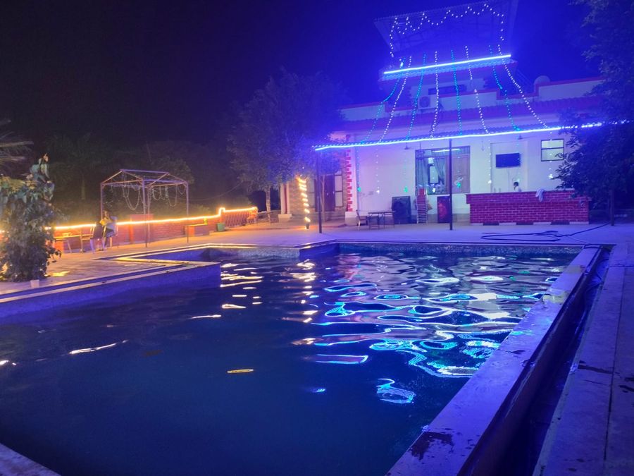 Night swimming pool with lighting stay viable farm house