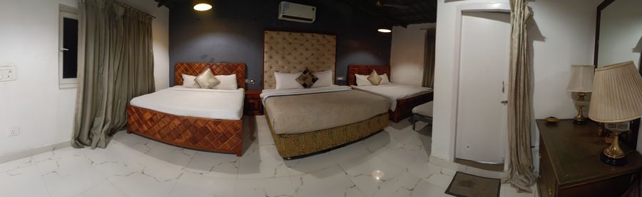 Spacious dormitory beds room setup near by farmhouse stay