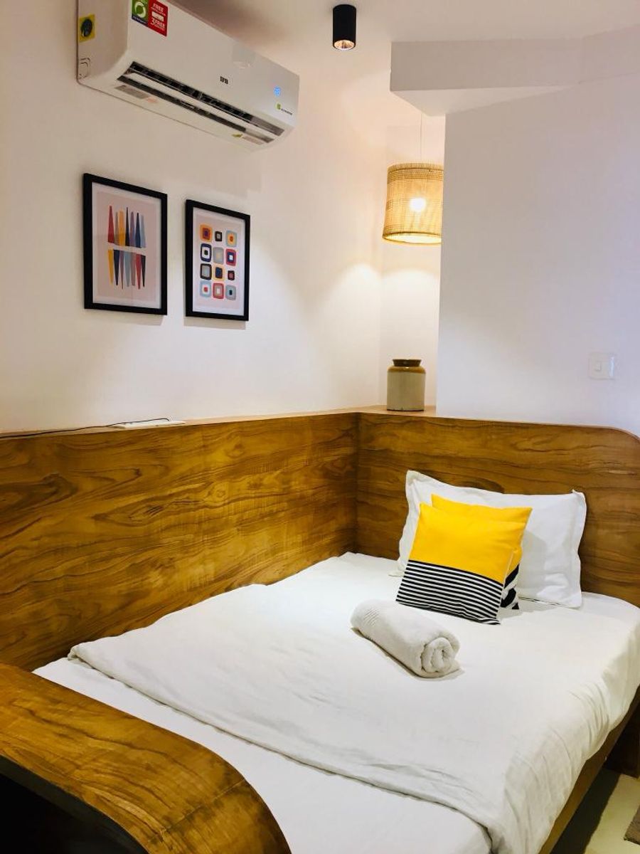 Single bed pod room interior setup at solo pod room 303 goa