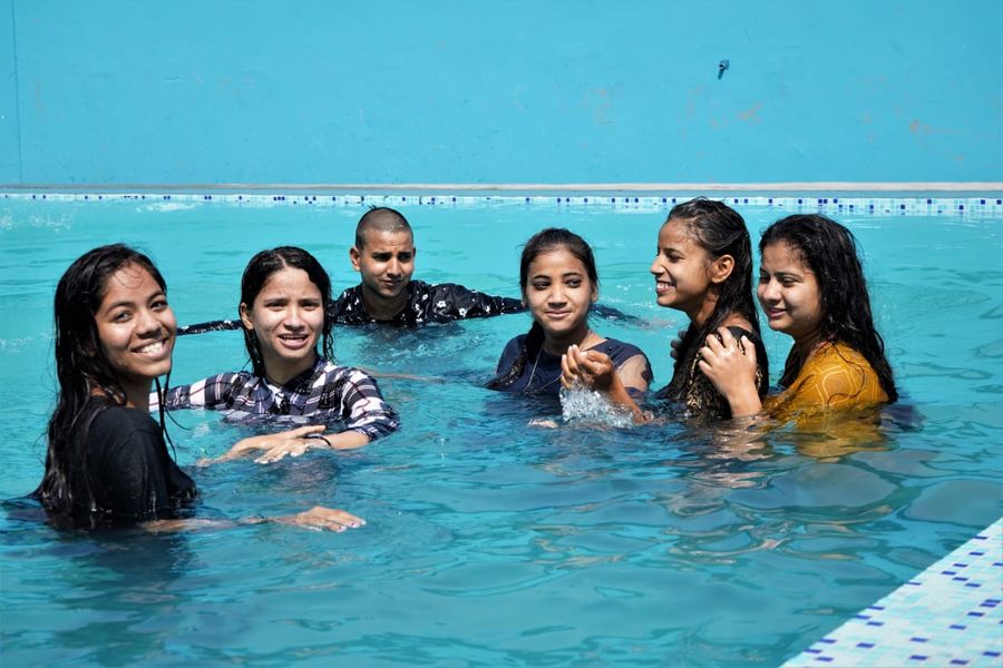 Outdoor swimming pool fun and refreshing splash activities in Rishikesh