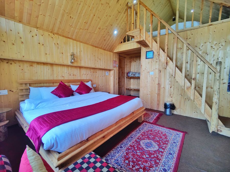 Wooden attic cottage bedroom in Shimla