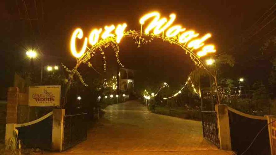 Illuminated entrance gate at cozy woods hill resort goa