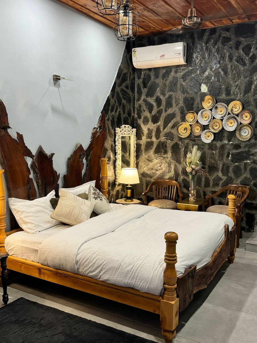 Rustic stone wall bedroom design cottage in mussoorie