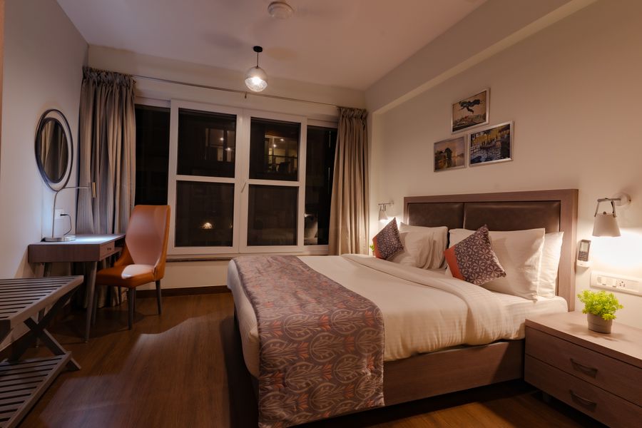 Spacious master bedroom suite at luxury apartments in goa
