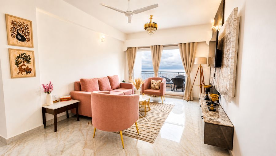 Spacious living lounge with pink armchairs homestay mussoorie
