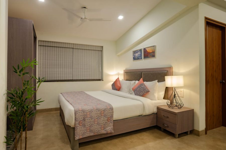Modern double bed guest bedroom in luxury apartments goa