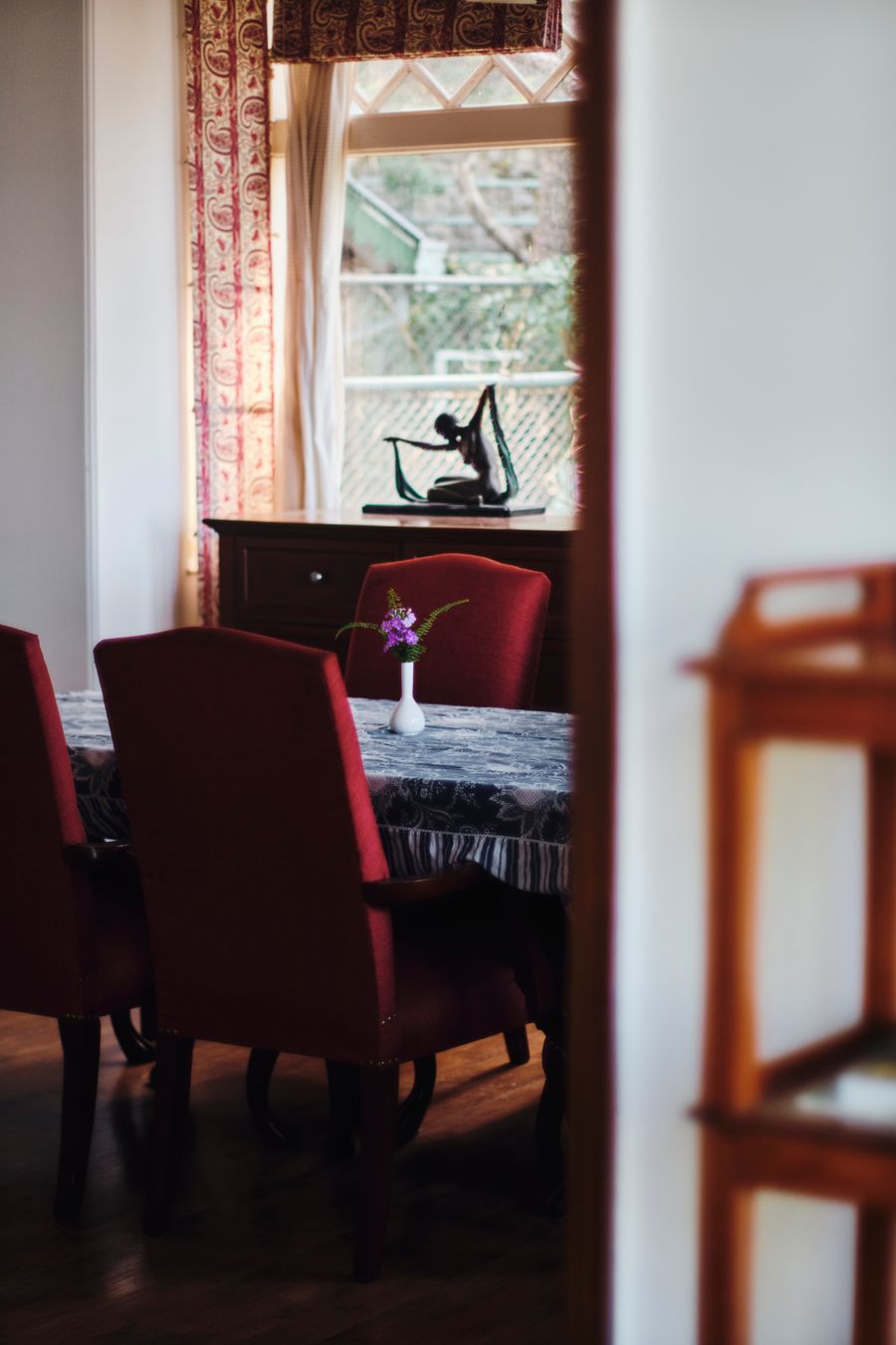 Classic dining nook with wooden table and chairs in Kasauli stay