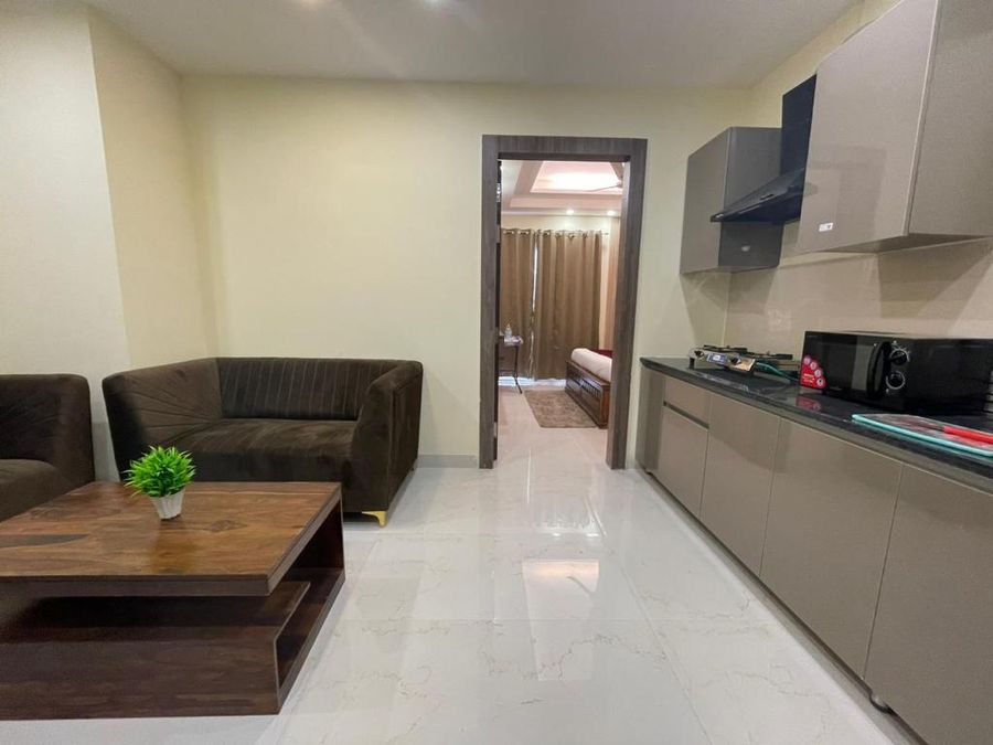 Living room sofa with kitchen at my stay service apartment