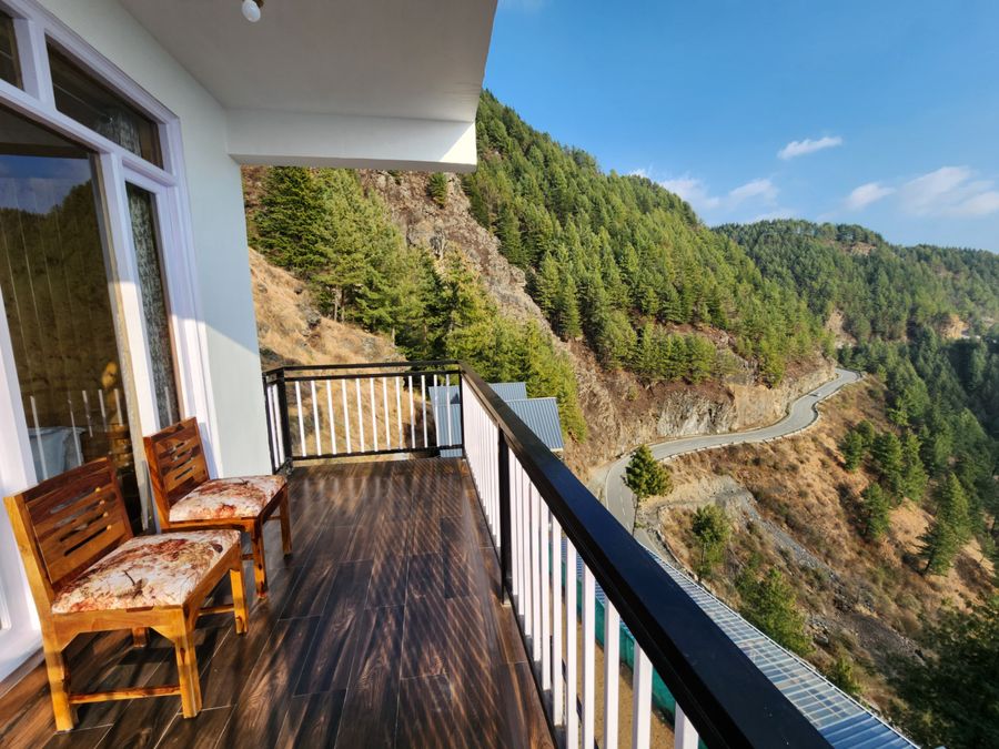 Scenic mountain deck sitting in Shimla stay