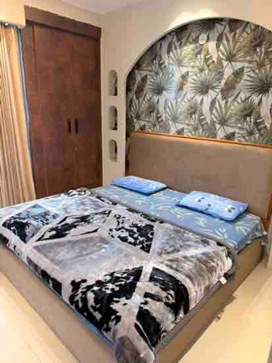 Modern guest bedroom with double bed inside luxury loft stay