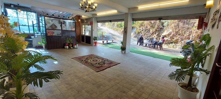 Spacious covered terrace lounge at ghai's sunrise homestay