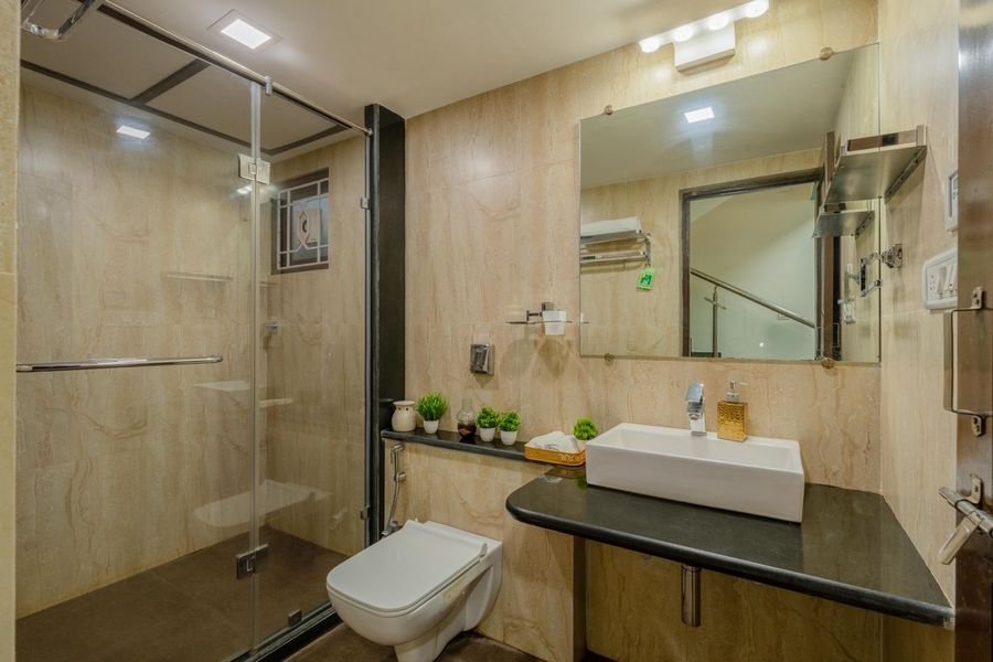 Modern bathroom with glass shower oasis villa assagao goa