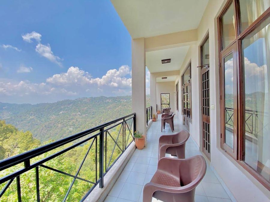 Open balcony corridor with scenic mountain views Kasauli