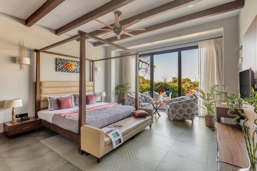 Luxury four poster bed bedroom at lavender villa in goa