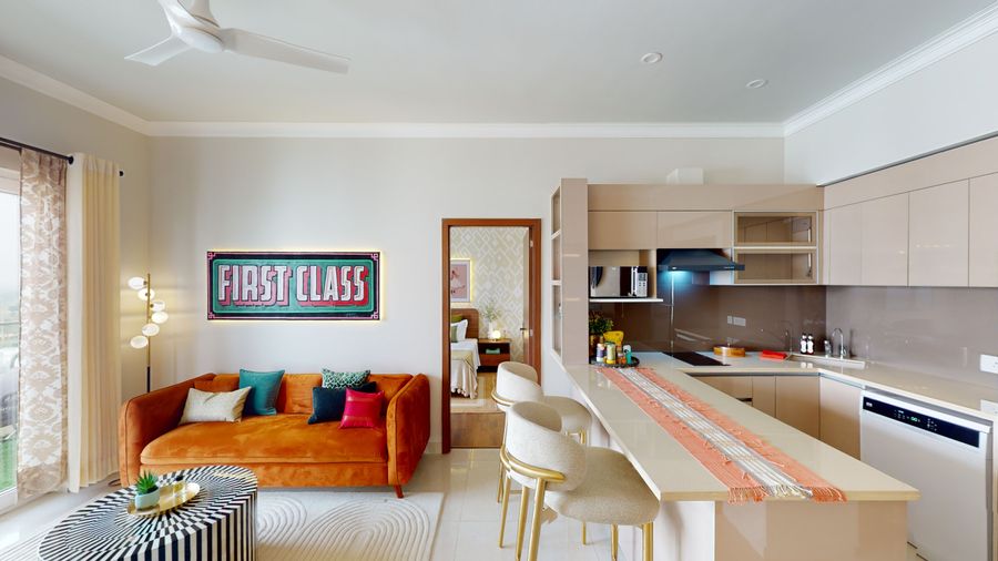 Spacious living room and kitchen at priya living flower valley