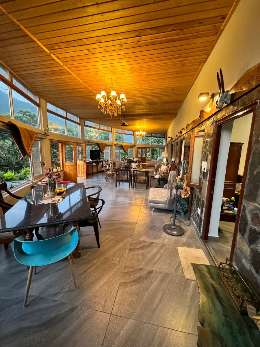 Sunlit glass lounge dining hall cottage near mussoorie