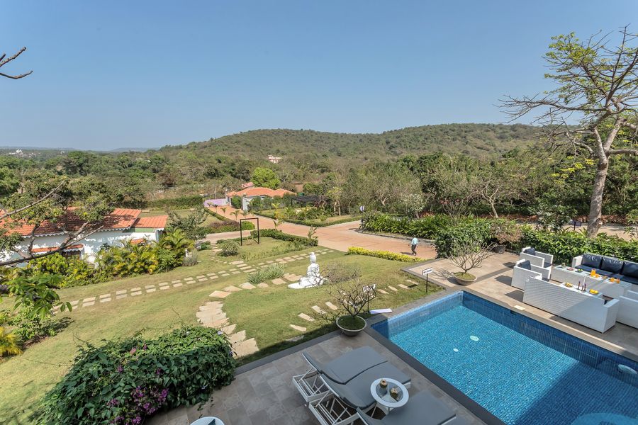 Aerial view of private pool and lawn at lavender villa goa