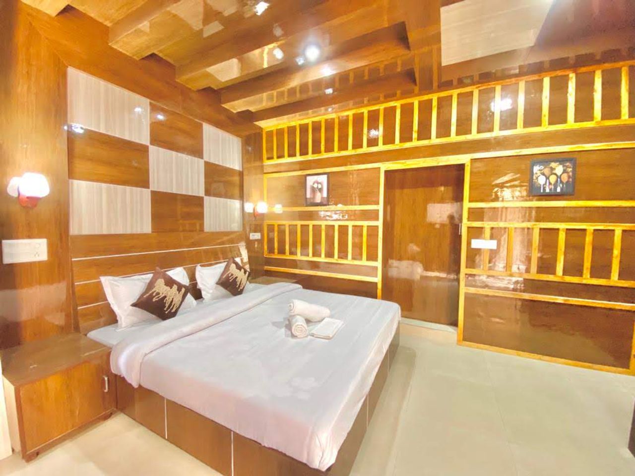 Wooden-paneled bedroom with comfortable double bed Kasauli